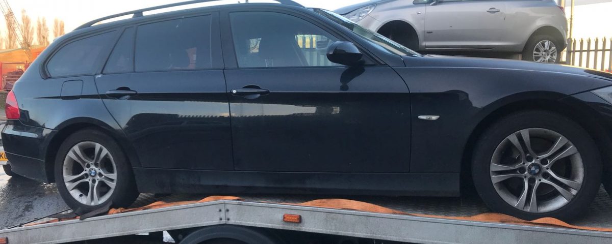 BMW loaded on truck